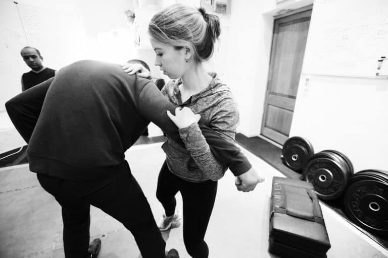 woman defending herself form man attacking her
